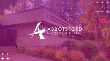 Picture of Abbotsford School Board office with pink overlay and logo in the middle