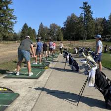 Golf Academy staff and students at driving range