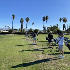 Golf Academy students at driving range in a warm climate